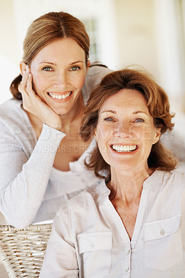 Buy stock photo Hug, portrait and laugh with senior mother and woman in home for bonding, support and love. Family visit, connection and happy with people in house for weekend break, care and embrace together