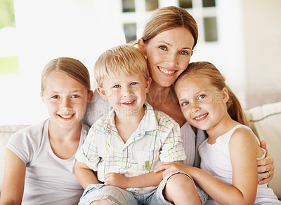 Buy stock photo Smile, calm and portrait of mother with children in home for bonding, support or connection. Love, happiness and relax with woman and kids on patio of family house for care, commitment or trust