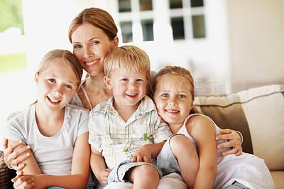 Buy stock photo Smile, hug and portrait mother with children in home for bonding, support or connection. Love, happiness and relax with woman and kids on patio of family house for care, commitment and trust together