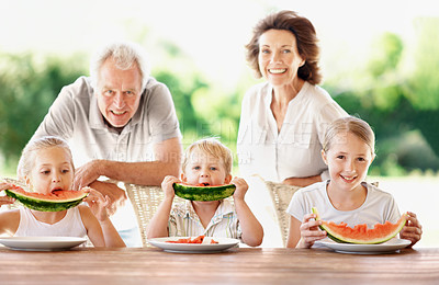 Buy stock photo Watermelon, happy and portrait with grandparents and children outdoor for summer, love and holiday. Fourth of July, relax and fruits with senior man and woman with kids in backyard of family home