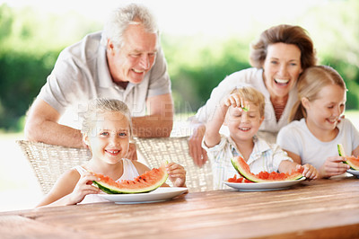 Buy stock photo Watermelon, laugh and portrait with grandparents and children outdoor for summer, love and holiday. Fourth of July, funny and fruits with senior man and woman with kids in backyard of family home