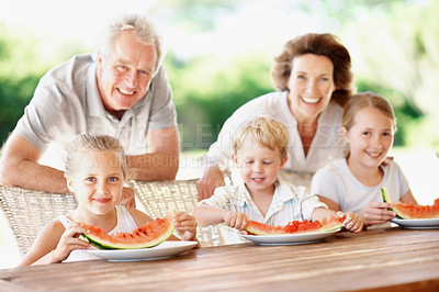 Buy stock photo Watermelon, smile and portrait with grandparents and children outdoor for summer, love and holiday. Fourth of July, relax and fruits with senior man and woman with kids in backyard of family home