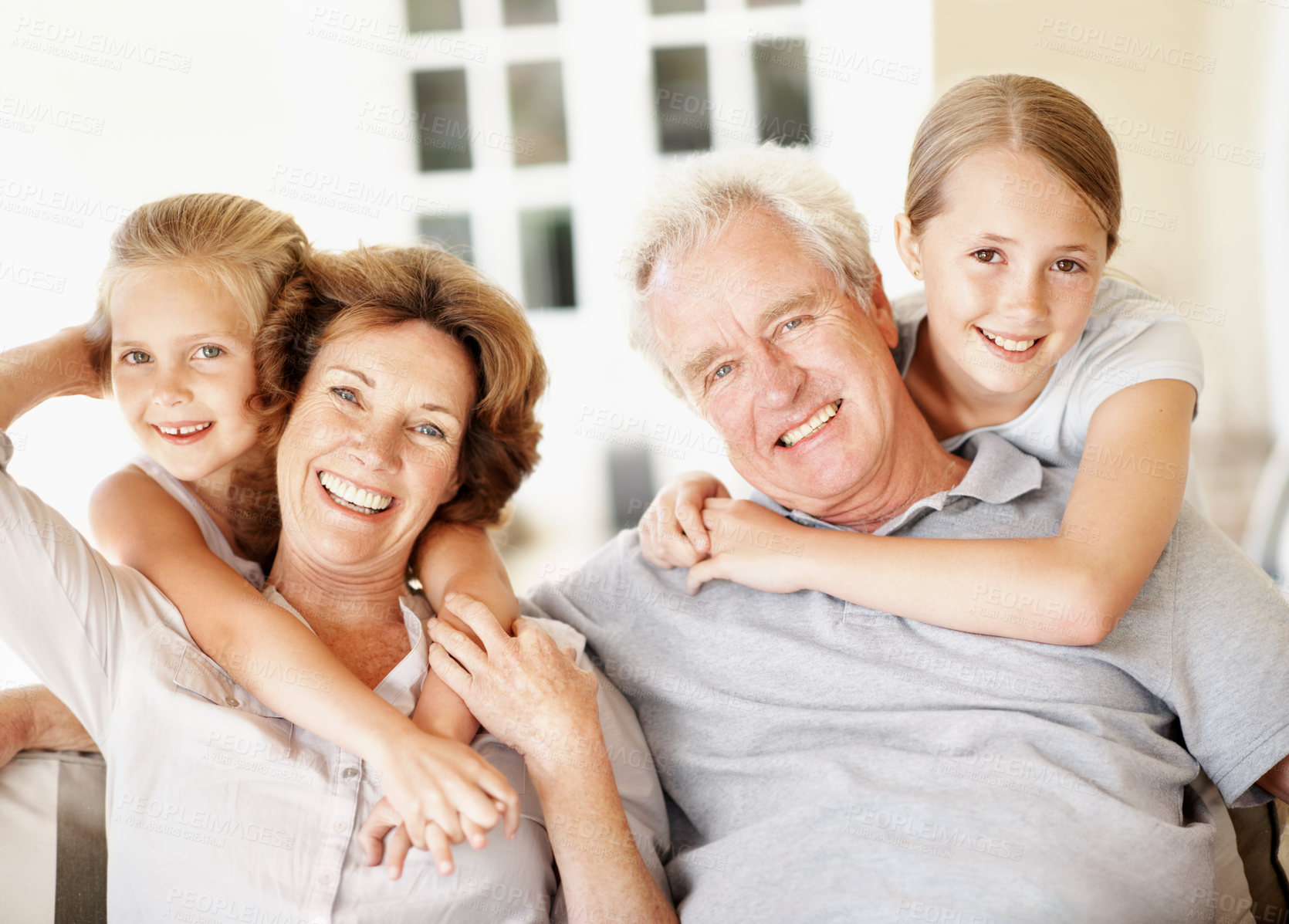 Buy stock photo Grandparents, kids and hug portrait in home for bonding together, babysitting weekend and security. Happy, senior people and grandchildren with embrace for holiday visit, family connection or support