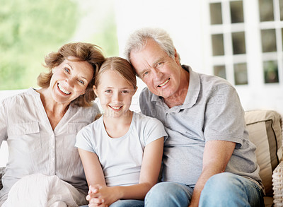 Buy stock photo Grandparents, child and happy portrait in home for bonding together, holiday visit and security. Love, senior people and grandchild with smile in house for weekend stay, family connection and support