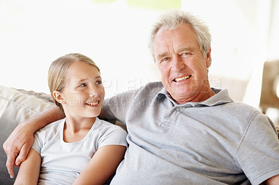 Buy stock photo Relax, smile and grandfather with child on sofa in home for bonding, support and connection. Love, family visit and weekend break with senior man and kid in apartment for trust, happy and care