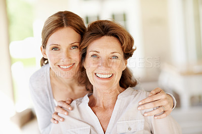 Buy stock photo Hug, portrait and smile with senior mother and woman in home for bonding, support and love. Family visit, connection and happy with people in house for weekend break, care and embrace together