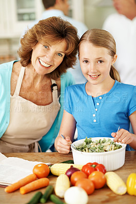 Buy stock photo Portrait, grandma and child in kitchen with cooking, family gathering and smile for healthy food. Happy, mature woman and girl grandchild in home with meal prep, help and learning for development.
