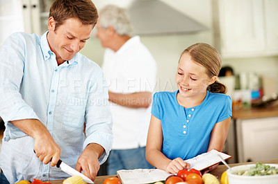 Buy stock photo Father, child and cooking in kitchen with family lunch, smile or chop vegetables for healthy nutrition. Happy, man and cut corn in house with daughter, food ingredients and recipe book for meal prep.
