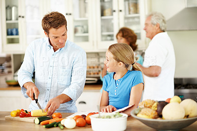 Buy stock photo Father, kid and cooking in kitchen with recipe book, smile and chop vegetables for healthy nutrition. Happy, girl child and dad cut corn in house with food, family lunch or instructions for meal prep