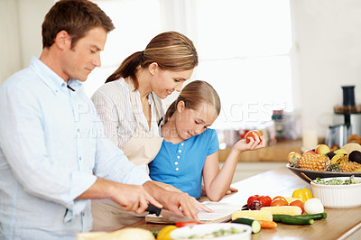 Buy stock photo Parents, recipe and cooking with child in kitchen, together or learning culinary skills in apartment. Family, portrait and meal prep with kid, love and happy people with ingredients for lunch in home