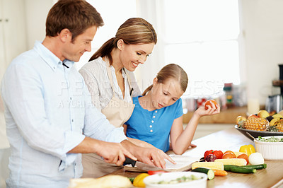 Buy stock photo Recipe, reading and family in kitchen for cooking, learning and help with meal prep together. Happy, ingredients and girl with mom, dad and cook book for vegetables, healthy dinner and lunch in home