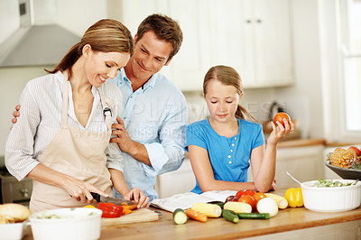 Buy stock photo Child, cooking and happy parents with vegetables in kitchen for healthy meal, dinner or preparation. Kid, daughter or learning food with mom, dad or natural organic ingredients for family recipe