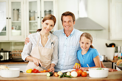 Buy stock photo Kitchen, parents and portrait of child for cooking, bonding and help for family lunch on weekend. Happy, hug and girl in home with mom, dad and vegetables for meal prep, healthy dinner and salad