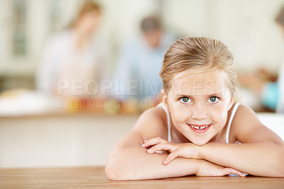 Buy stock photo Child, portrait and happy girl in home for childhood care, growth or development with parents. Kid, daughter or smile with positive attitude on table for holiday, weekend or summer break in house