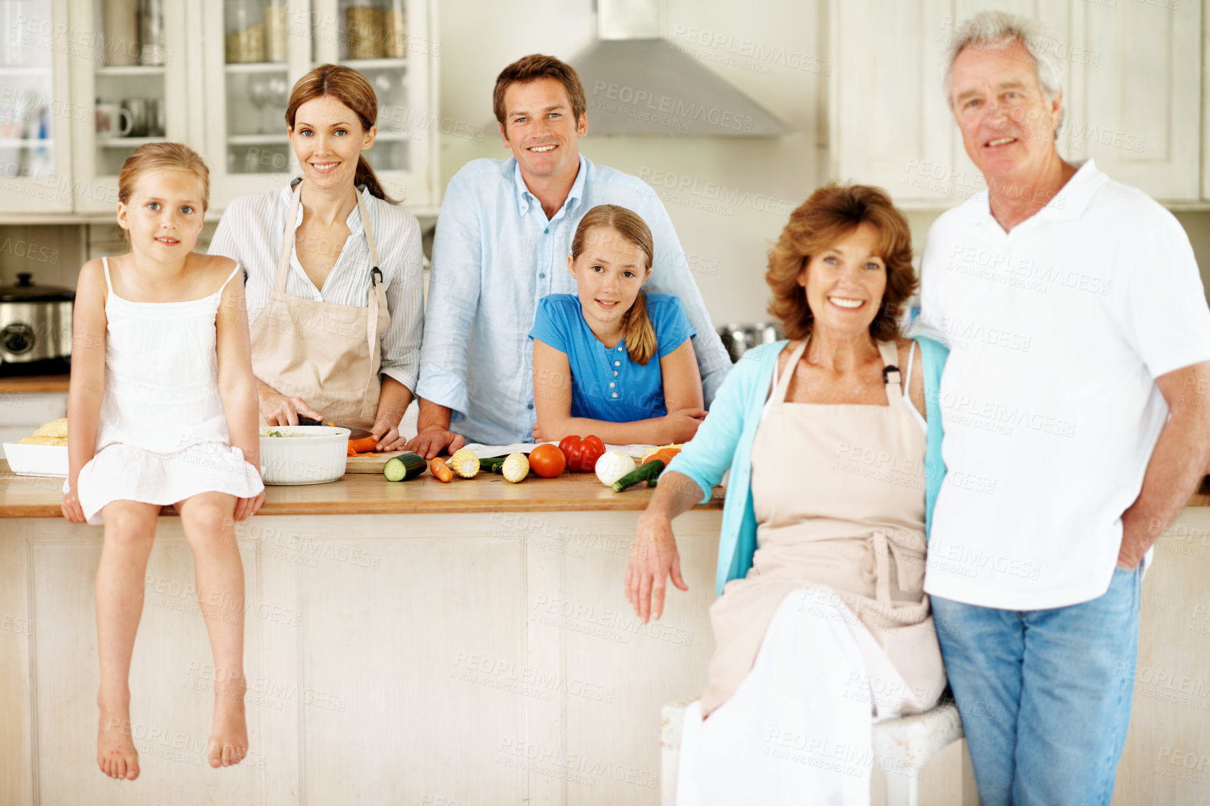 Buy stock photo Grandparents, parents and portrait of kids in kitchen for cooking, bonding and help for family lunch. Happy, generations and girls with mom, dad and senior people for meal prep, dinner and vegetables