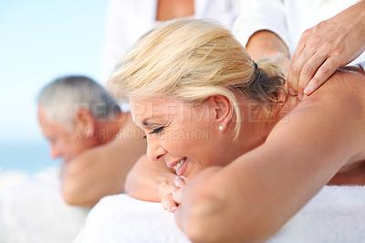 Buy stock photo Woman, couple and massage at outdoor spa with smile, anniversary vacation or stress relief for wellness. Happy, married mature people and relax at luxury resort with masseuse, body care and holiday.