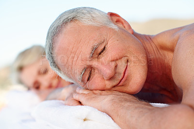 Buy stock photo Vacation, massage and old man in outdoor spa for smile, relax and marriage anniversary for trip. Love, luxury resort and elderly couple with senior people for stress relief, holiday or hospitality
