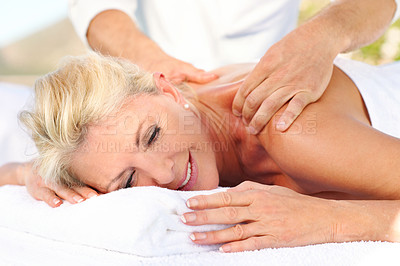 Buy stock photo Senior woman, relax and back massage at spa, holistic healing and luxury treatment for stress relief. Resort, masseuse and mature person with smile on break, body care and resting on holiday or space