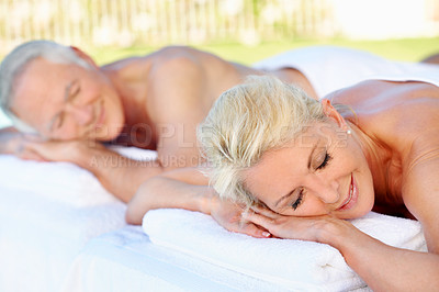 Buy stock photo Elderly, couple or peace at massage spa, outdoor resort or luxury wellness with smile on holiday. Man, woman and table for holistic therapy, relax or calm on vacation in retirement with stress relief