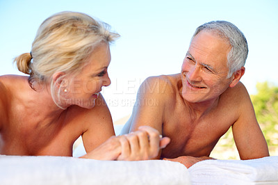 Buy stock photo Smile, massage and elderly couple in outdoor spa for holiday, retirement and marriage anniversary. Love, luxury resort and happy woman with senior man for stress relief, vacation and hospitality