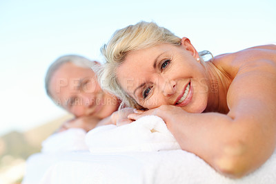 Buy stock photo Happy woman, elderly couple and relax at spa, outdoor resort and luxury wellness on holiday. Smile, people and massage table at salon, peace or stress relief with portrait for vacation in retirement