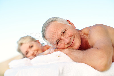 Buy stock photo Happy man, elderly couple and relax at spa, outdoor resort and luxury wellness on holiday. Smile, people and massage table for holistic therapy, calm or stress relief with portrait in retirement