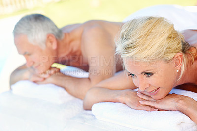 Buy stock photo Senior, couple and relax at massage spa, outdoor resort and luxury wellness with smile on holiday. Man, woman and table at salon, peace or health with calm for vacation in retirement with happiness