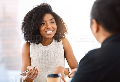 Buy stock photo Shot of a young businessman and businesswoman having a meeting in a modern office