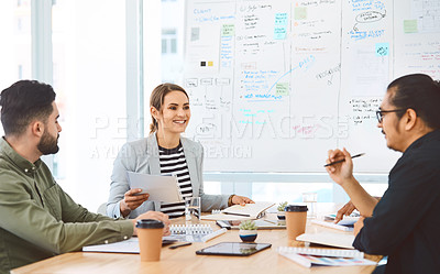 Buy stock photo Shot of a group of young businesspeople having a meeting in a modern office