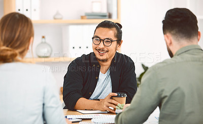 Buy stock photo Shot of a group of young businesspeople having a meeting in a modern office