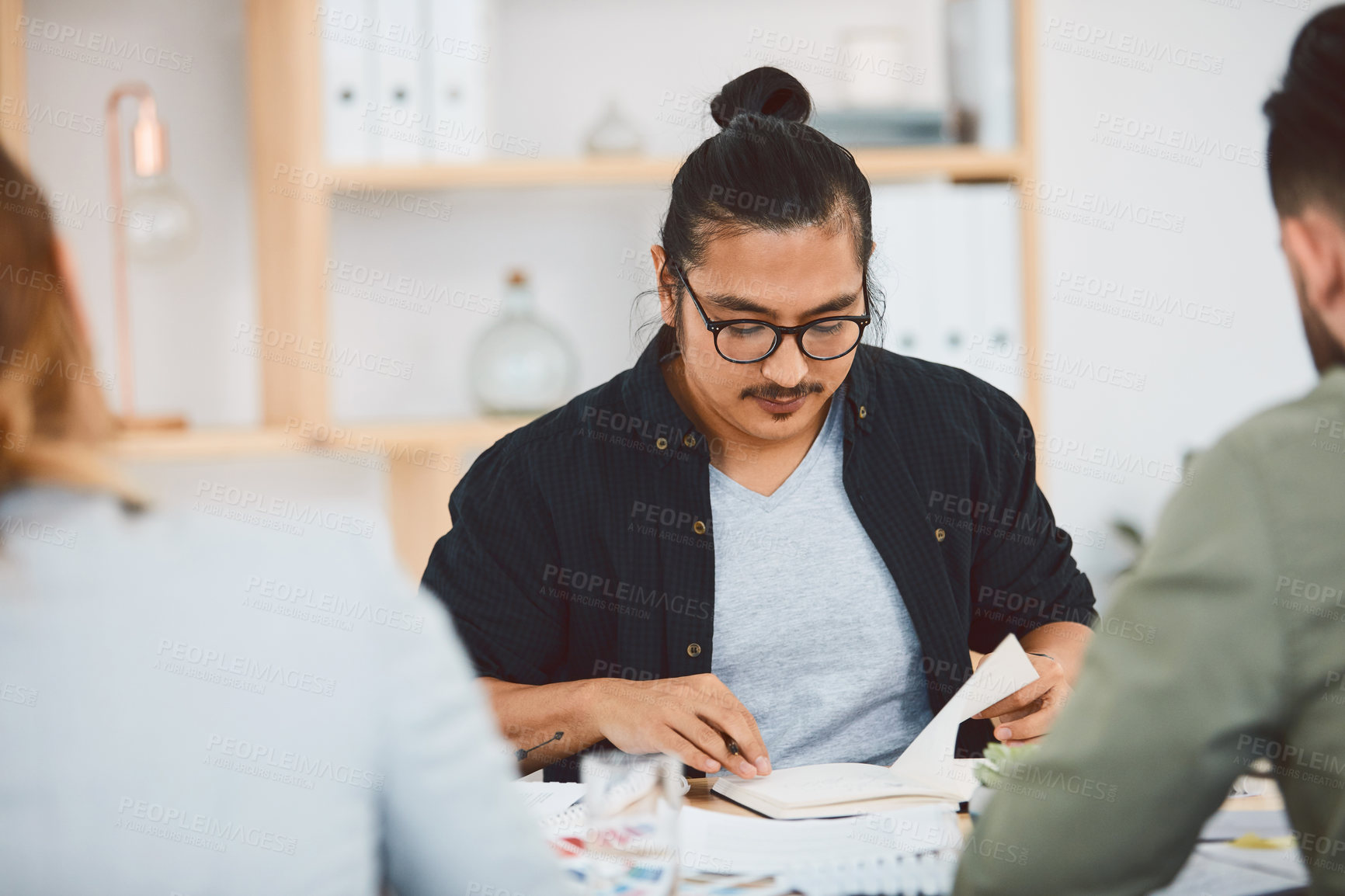 Buy stock photo Meeting, man and notebook with business people in office for event planner, proposal or feedback. Schedule, project management or startup with team in creative agency for venue budget or agenda