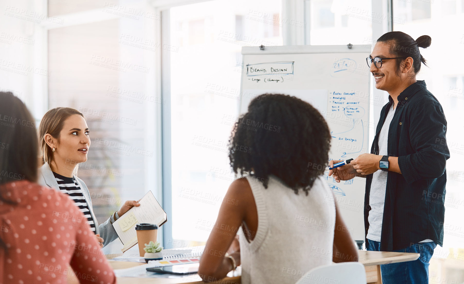 Buy stock photo Coaching, team and happy man with whiteboard for presentation, teaching or creative feedback. Male person, speaker or discussion with notes for brainstorming, planning or project strategy at work