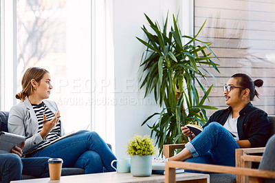 Buy stock photo Shot of a young businessman and businesswoman having a meeting in a modern office