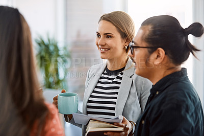Buy stock photo Shot of a group of young businesspeople having a meeting in a modern office