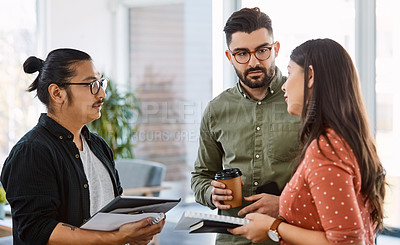 Buy stock photo Shot of a group of young businesspeople having a meeting in a modern office