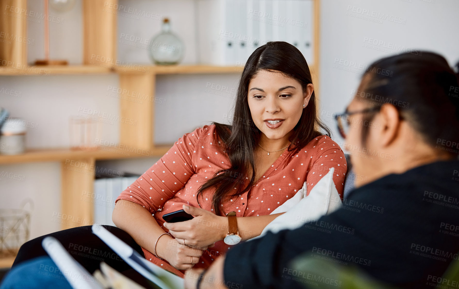 Buy stock photo Shot of a young businessman and businesswoman having a meeting in a modern office