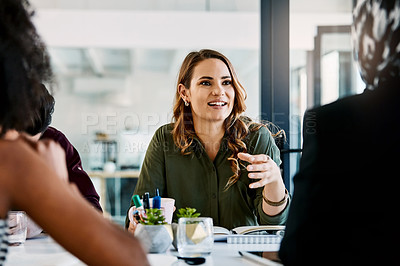 Buy stock photo Shot of three young businesswomen having a meeting together at work