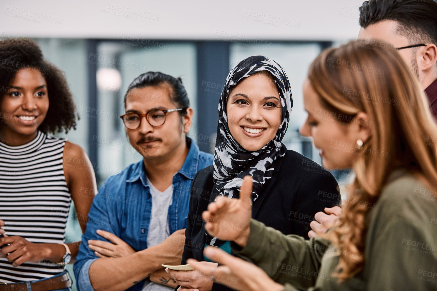 Buy stock photo Shot of a group of young businesspeople planning and writing notes on a glass wall in an office at work