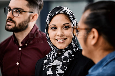 Buy stock photo Shot of a group of young businesspeople planning and writing notes on a glass wall in an office at work