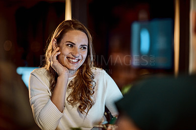 Buy stock photo Shot of a group of young businesspeople having a late night meeting at work