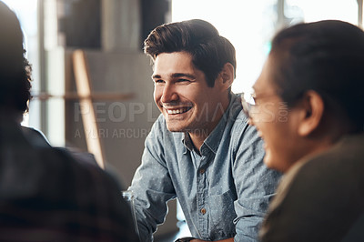 Buy stock photo Shot of a diverse young group sitting together and smiling in a coffee shop during the day