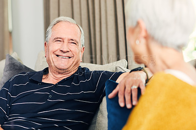 Buy stock photo Shot of a happy senior couple relaxing together on the sofa at home