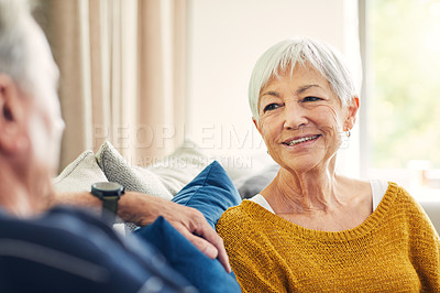 Buy stock photo Shot of a happy senior couple relaxing together on the sofa at home
