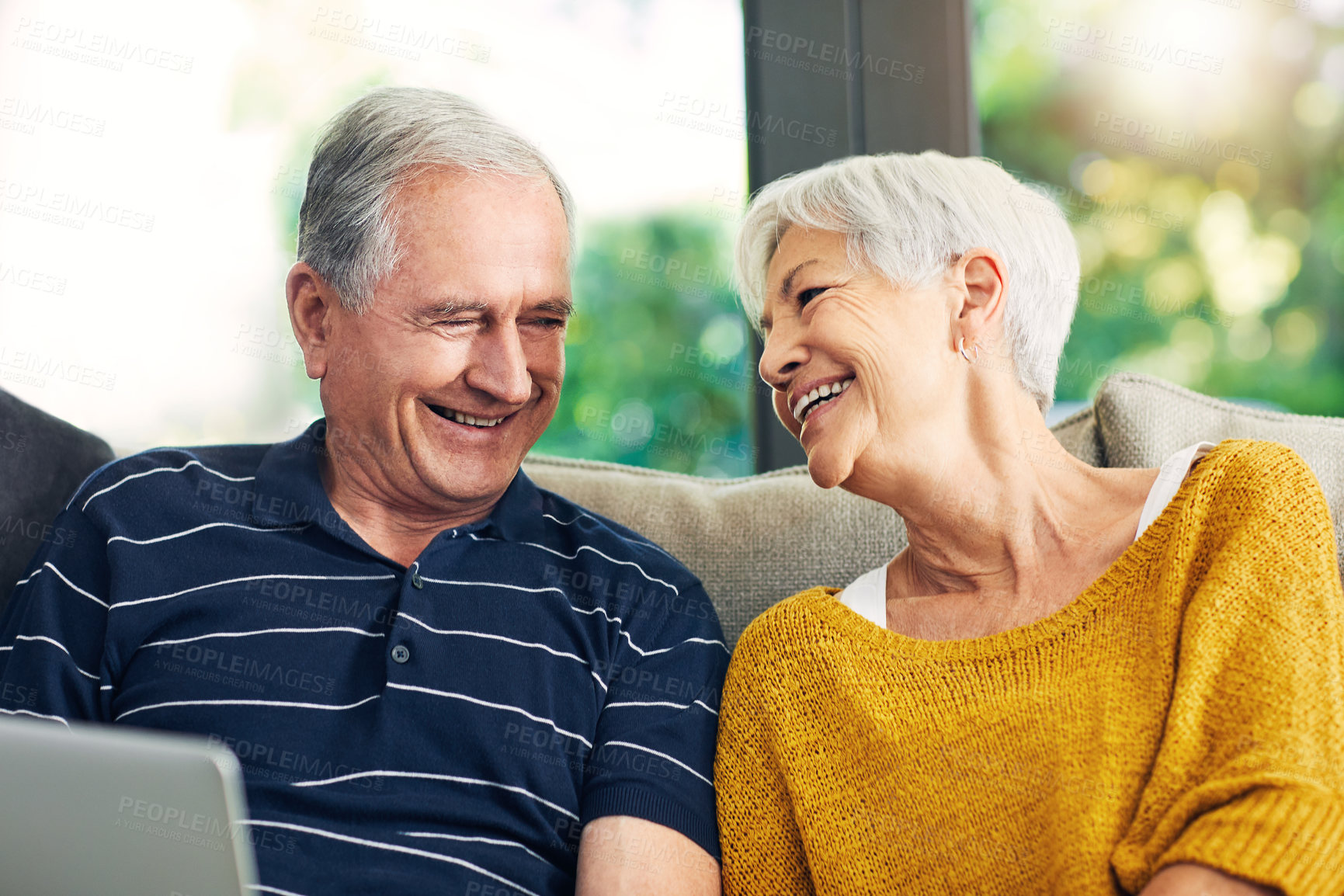 Buy stock photo Laptop, love and old couple on sofa for movie, streaming show or film together in living room. Smile, technology and elderly man with woman in retirement for bonding, video and subscription in home