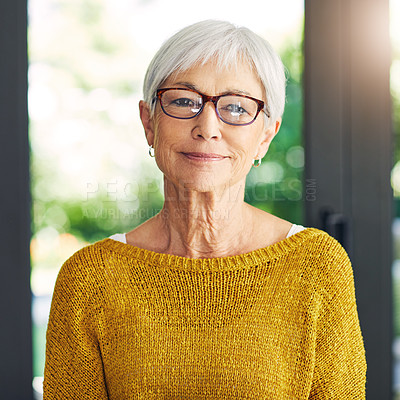 Buy stock photo Shot of a confident senior woman standing in her home