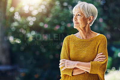 Buy stock photo Shot of a confident senior woman looking thoughtful outdoors