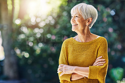Buy stock photo Shot of a confident senior woman looking thoughtful outdoors