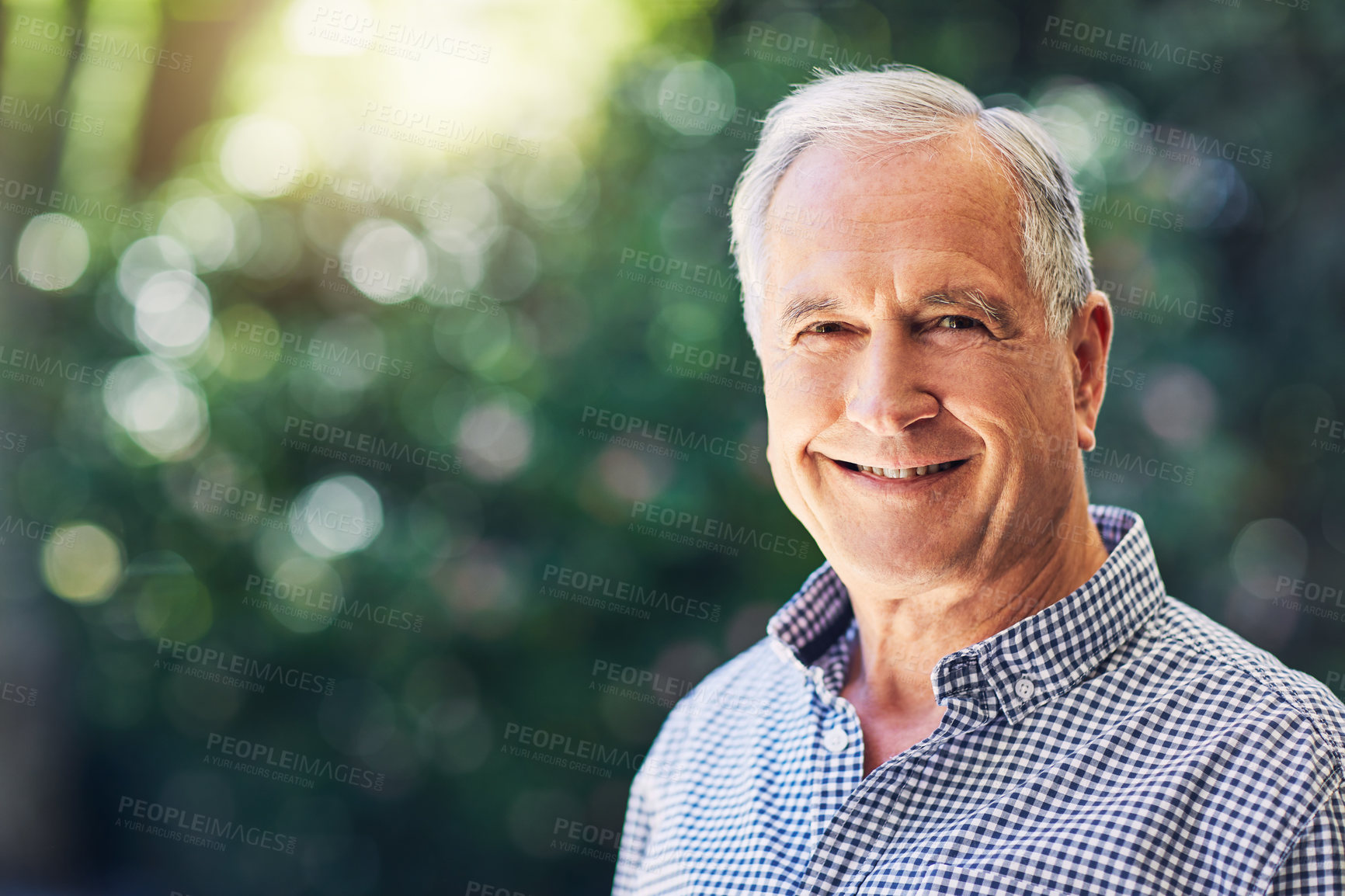 Buy stock photo Shot of a happy senior man standing outdoors