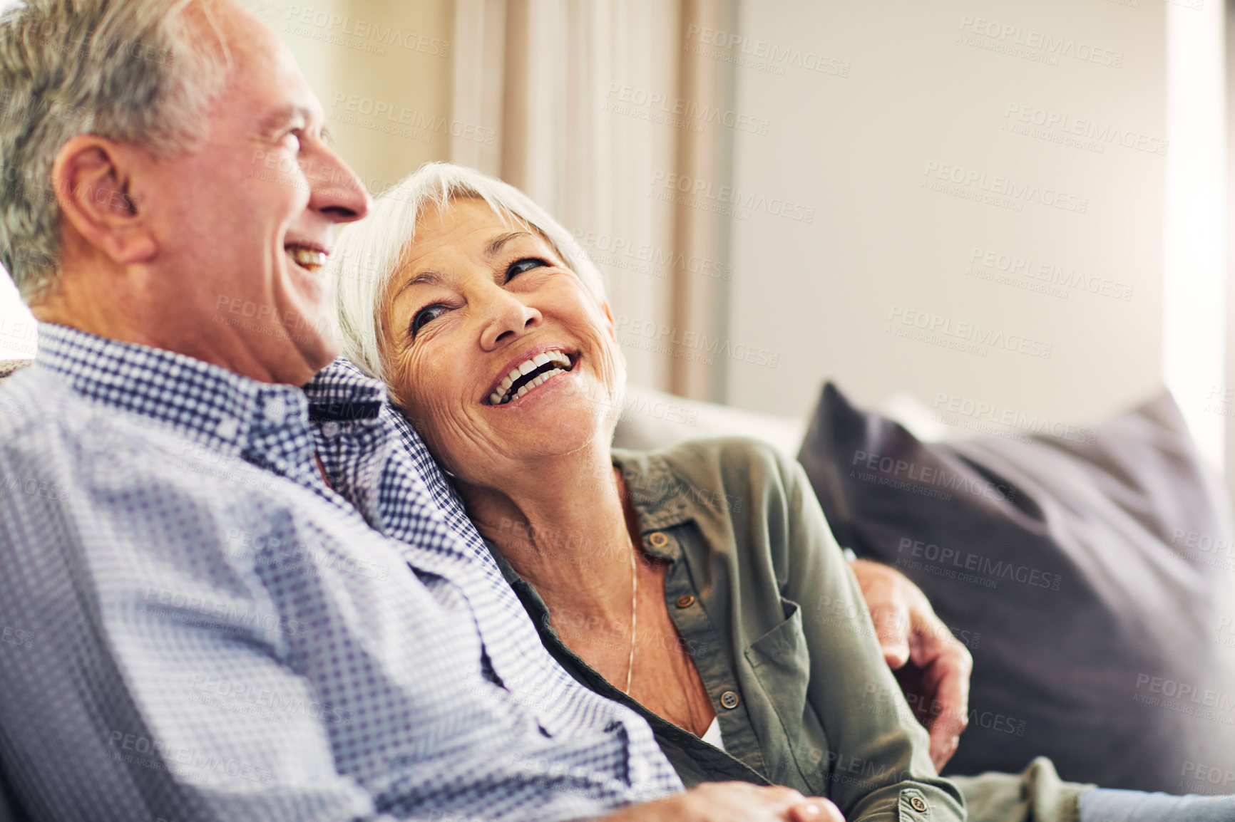 Buy stock photo Love, elderly couple and woman with laugh on sofa for funny conversation, relationship or bonding. Hug, happy senior people and talking in home for connection, retirement support and joke with cuddle