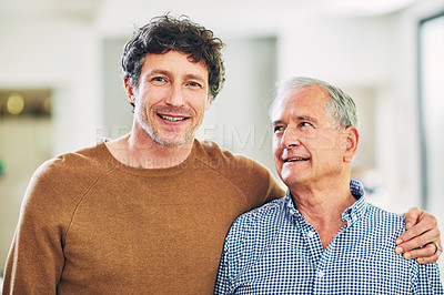 Buy stock photo Portrait of a mature man and his elderly father spending quality time at home